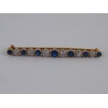 An Edwardian 18 carat gold and platinum sapphire and diamond brooch,