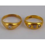 A mixed lot comprising two 18 carat gold diamond rings, both marked 18ct, sizes T and Y,