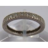 A white metal (tests platinum) diamond eternity ring, unascribed marks, size M, approx 2.
