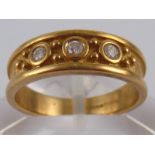 A 9 carat gold diamond three stone ring, size P, 4.7 gms.