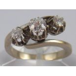 A French hallmarked 18 carat white gold three stone diamond ring,