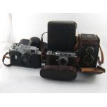 Four cameras, being a Rolleicord in ER case, a Soviet 35mm.