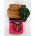 A Butler & Wilson beaded evening bag together with two vintage evening bags.