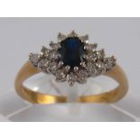 A 9 carat gold sapphire and diamond cluster ring, size L, 2.3 gms.