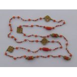 A fine antique gold (tests approx 14 carat) filigree coral necklace, largest bead approx 14.