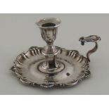 A Victorian silver chamberstick with scroll and shell border, Henry Wilkinson & Co.
