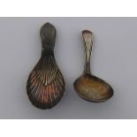 A Georgian silver deep circular bowl caddy spoon with Old English Thread handle by William Eley and