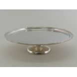 A large modern silver-plated tazza with reed and ribbon border,