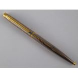 An Elysee Empire electroplated gold ballpoint pen.