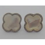A pair of white metal (tests 18 carat gold) mother of pearl and diamond earrings, approx 1.5cm, 3.