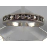 Tiffany & Co. A platinum and diamond half eternity ring by Tiffany & Co, ring size H ½, 4.8 gms.