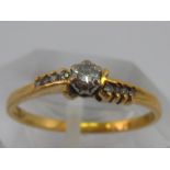 An 18 carat gold diamond ring, size N, 1.9 gms.