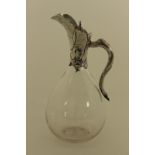 A Victorian silver mounted claret jug , the clear teardrop body with star cut base,