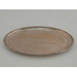An Italian silver oval tray with gadroon border, stamped .800, 37.7 cm. long, 697 gm.