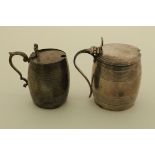 Two silver barrel shaped mustard pots, no liners, one Georgian, John Wrenn, London, 1798, ht.8cm.