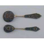 Two Russian silver-gilt and plique-a-jour spoons with cloisonne enamel bead borders,