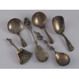 A Georgian silver caddy spoon, Thomas Wallis, London, 1805, another two, both Joseph Taylor,