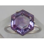 A white metal (tests 18 carat gold) amethyst ring, amethyst approx 11mm wide, ring size N, 2.8 gms.