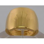 Cartier . An 18 carat gold ring by Cartier, signed and numbered, size M (53)12.5 gms.