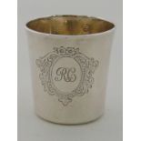 A 19th. century French, 950 standard, silver beaker with engraved initials and cartouche. Ht.6cm.