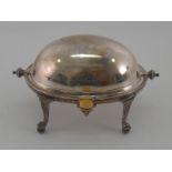 A Victorian silver butter dish with swing over cover on reeded legs with claw and ball feet by