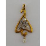 A yellow metal (tests 18 carat gold) Art Nouveau pendant, approx 3.5cm drop, 1.5 gms.