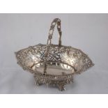 A Georgian silver basket with cast swing handle, shaped gadrooned edge,