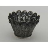 A silver filigree cachepot, the foliage like panels with small applied filigree florets. 13cm.