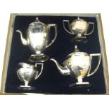 A four piece Chinese silver teaset in panelled Adam style,
