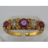 A yellow metal (tests 18 carat gold) ruby and diamond ring, principal ruby approx 4.