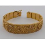 A yellow metal (tests 18 carat gold) bracelet, approx 2cm wide, 18cm long, 49.4 gms.