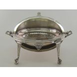 An oval silver turn-over breakfast dish by William Hutton & Sons Ltd.