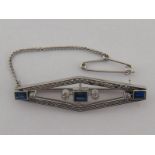 An Art Deco diamond and synthetic sapphire bar brooch,