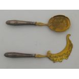 A pair of continental ice cream servers, the blades engraved and gilt,