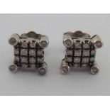 A pair of 18 carat white gold and diamond ear studs,