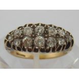 A late 19th century 18 carat gold and diamond ring, the two rows of old cuts totalling approx. .