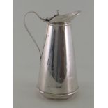 An Arts & Crafts silver hot water jug with insulated white enamel liner, by W. A. S. Benson & Co.