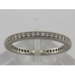 A Tiffany platinum and diamond eternity ring, signed to inner shank, 2mm width, finger size T, 4.