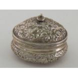 A Sicilian silver covered sugar bowl, oval and chased with birds and flowers,