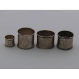 Four Russian silver napkin rings with beaded edges comprising one by JAL , unascribed,