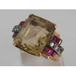 A large yellow metal (tests as 14 carat gold) citrine dress ring, the large mixed cut stone 18.