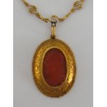 PAPAL INTEREST: A fine mid 19th century gold and carnelian cameo pendant,