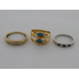 A mixed lot, comprising a 9 carat yellow gold diamond half hoop ring, a 9 carat white gold,