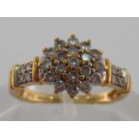 A 9 carat gold and diamond cluster ring,