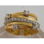 An Italian 18 carat gold and diamond illusion ring by Marco Bicego,