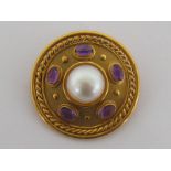 An 18 carat yellow gold, cabochon amethyst and cultured pearl boss brooch, the central pearl 12.