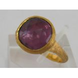 An Italian 18 carat yellow gold and amethyst ring by Marco Bicego, the rose cut stone 10.