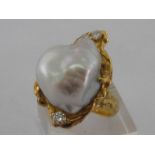 A baroque pearl and diamond dress ring, the large untested pearl 20.3 x 17.