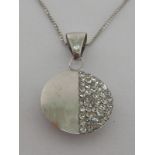 An 18 carat white gold and cubic zirconia pendant,