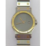 CARTIER Santos, a mid size stainless steel and gold automatic wristwatch, no.